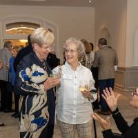 Nancy Lubbers and Diane Patton chatting with other event attendee